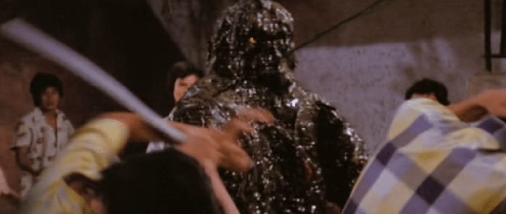 At one point the Oily Maniac spits out oil...