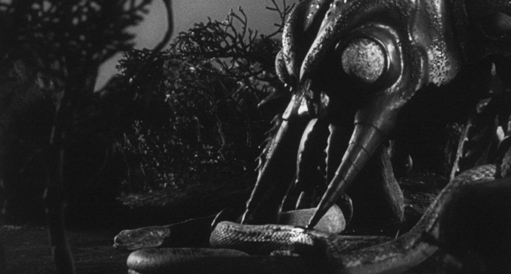 ...and the snake gets skewered by one of the wasps!