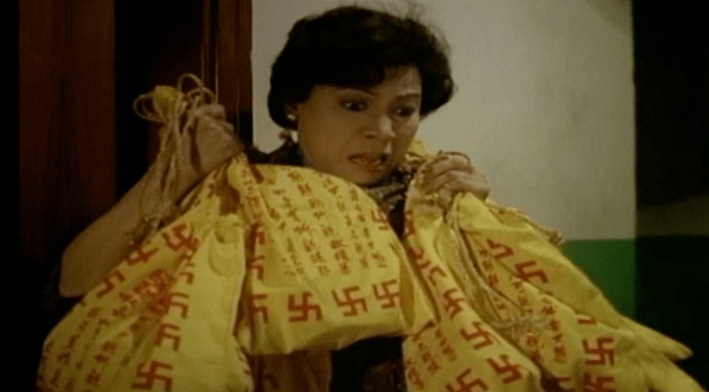 
The scared landlady holds a bunch of ghost-filled drawstring bags