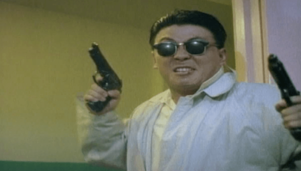 The dumbass cop dude dreams he is Chow Yun-Fat
