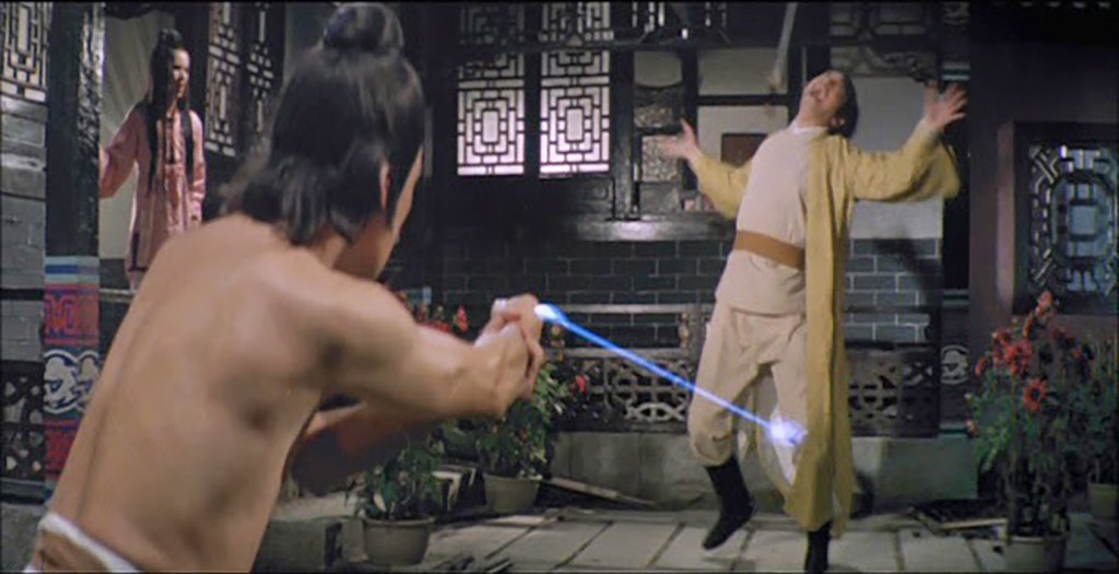 Using a finger-beam to shoot at the legs of his lover's husband!