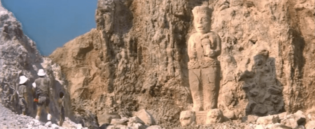 ...where they discover an enigmatic statue