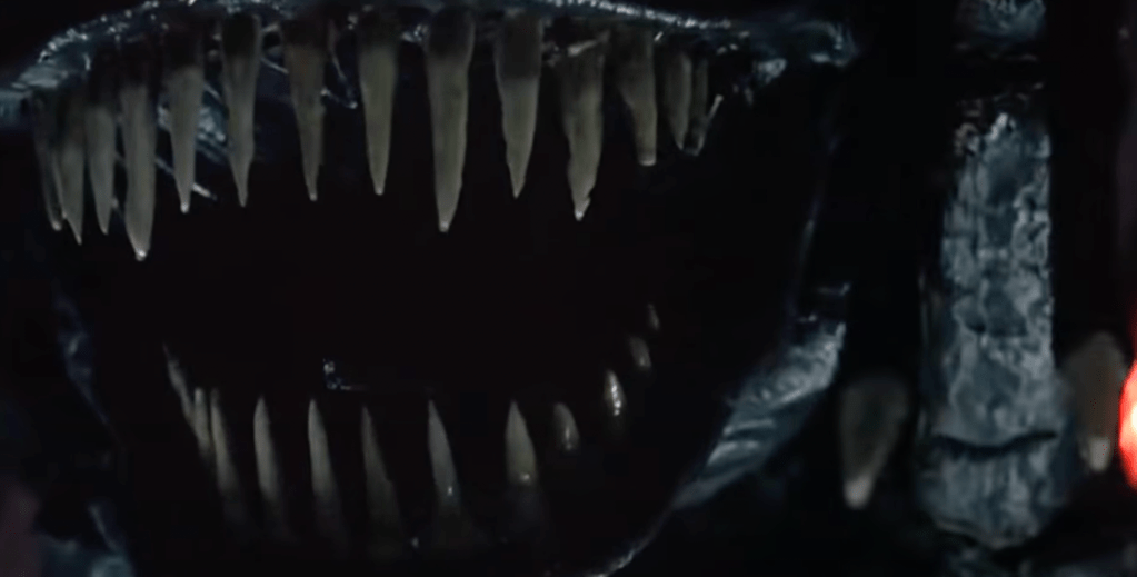 As the organism evolves, it gains a maw full of big teeth