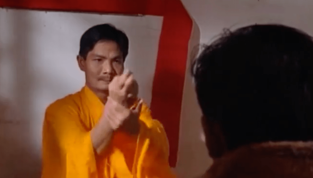 A holy man does some fancy hand movements