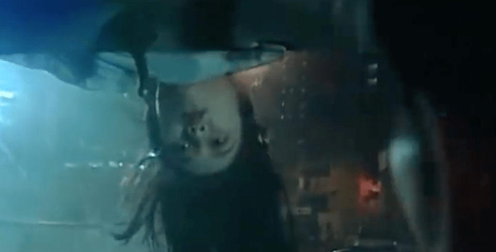 ...and she ends up peering at him from the car roof