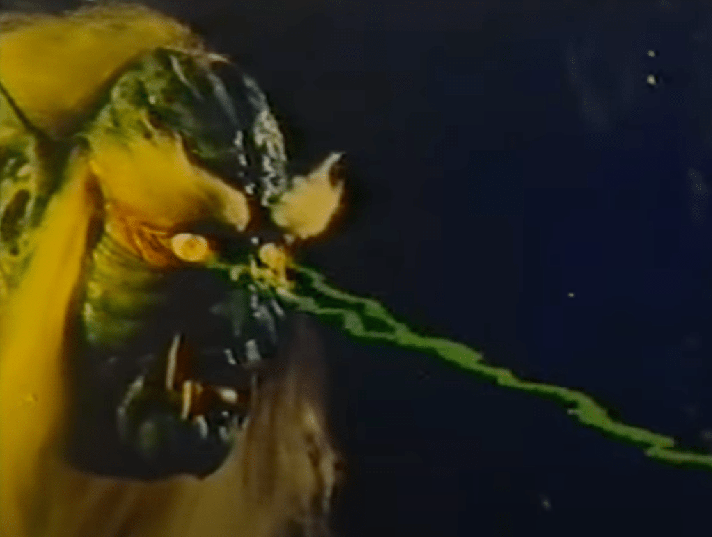 Giant, floating monster head fires green lightning bolts from its eyes!