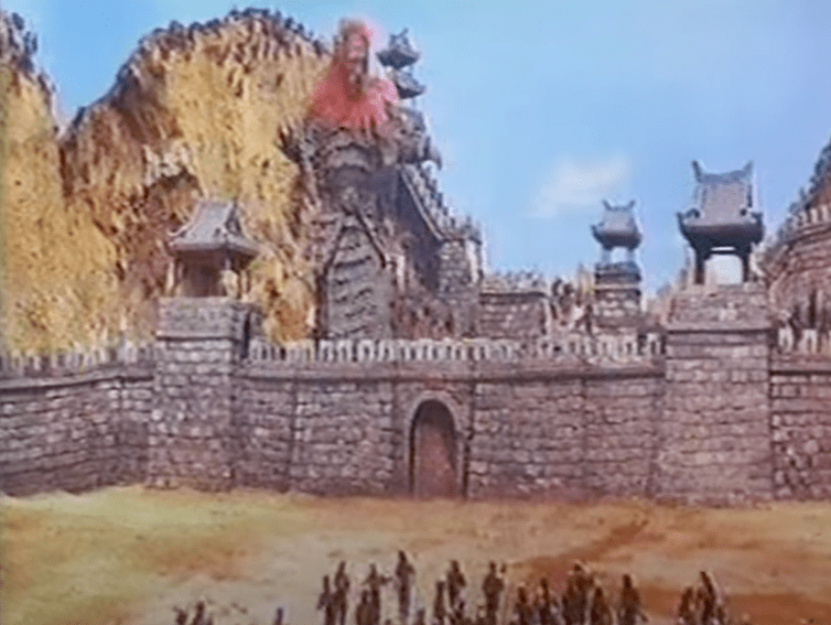 'Red Devil' towers over ancient battlements!