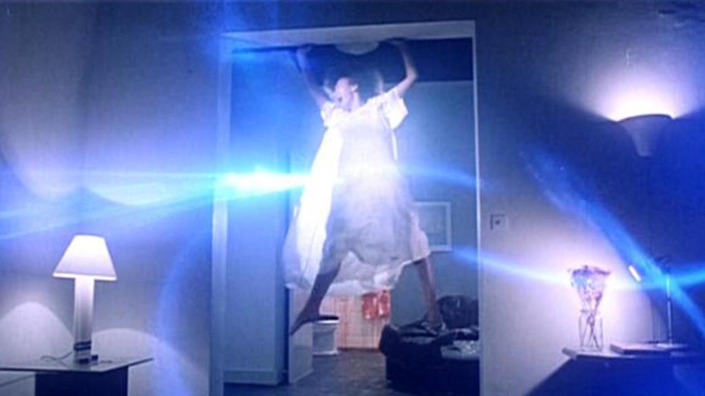 Lots of swirling spectral lights as the evil cat spirit enters Tina's body