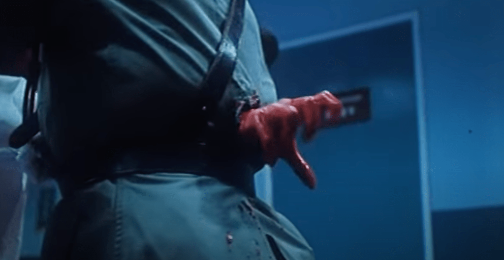 A cop has a hand rammed right through his body