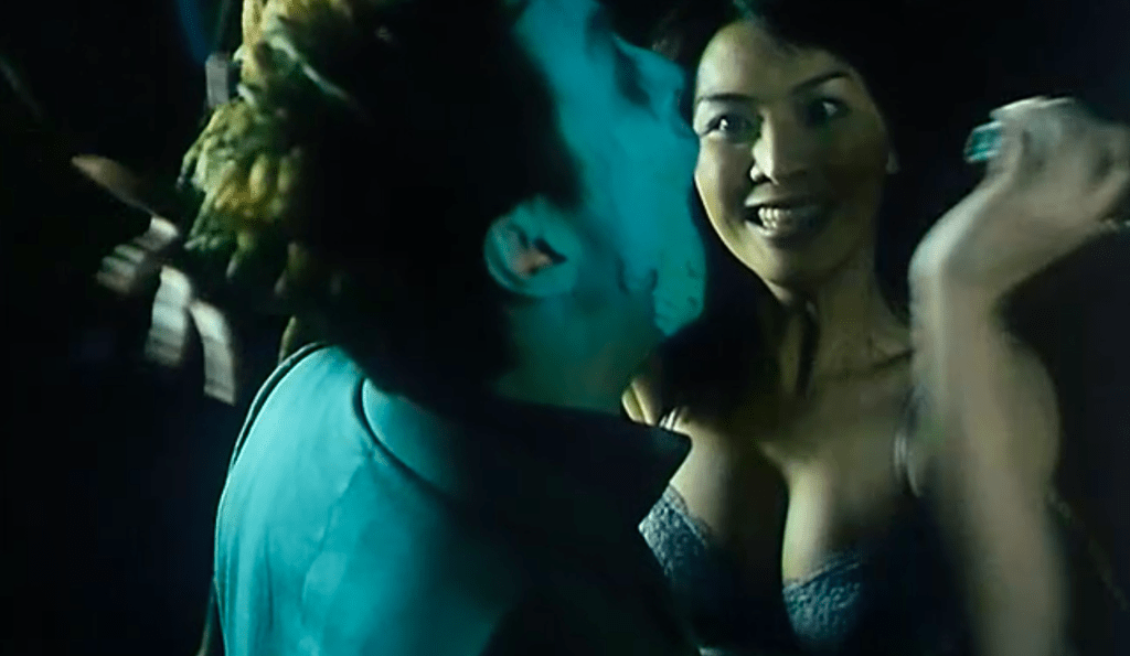 She's going to ram a grenade into his mouth!