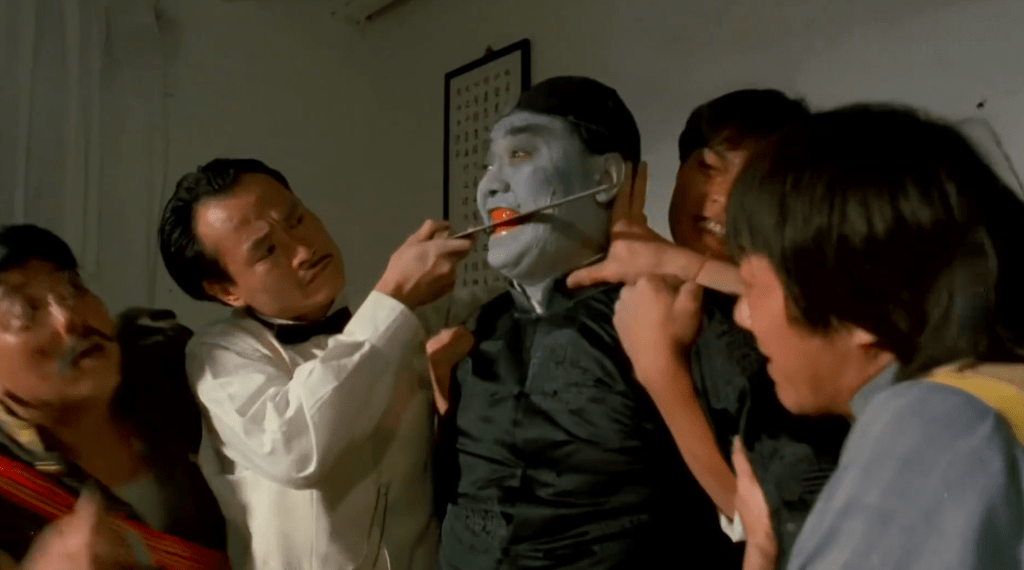 Master Lam Ching-Ying files down the fangs of the General's father, who has become a vampire