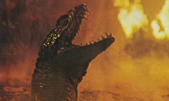 An aquatic reptile roars as the volcanic eruption starts to heat-up the river water