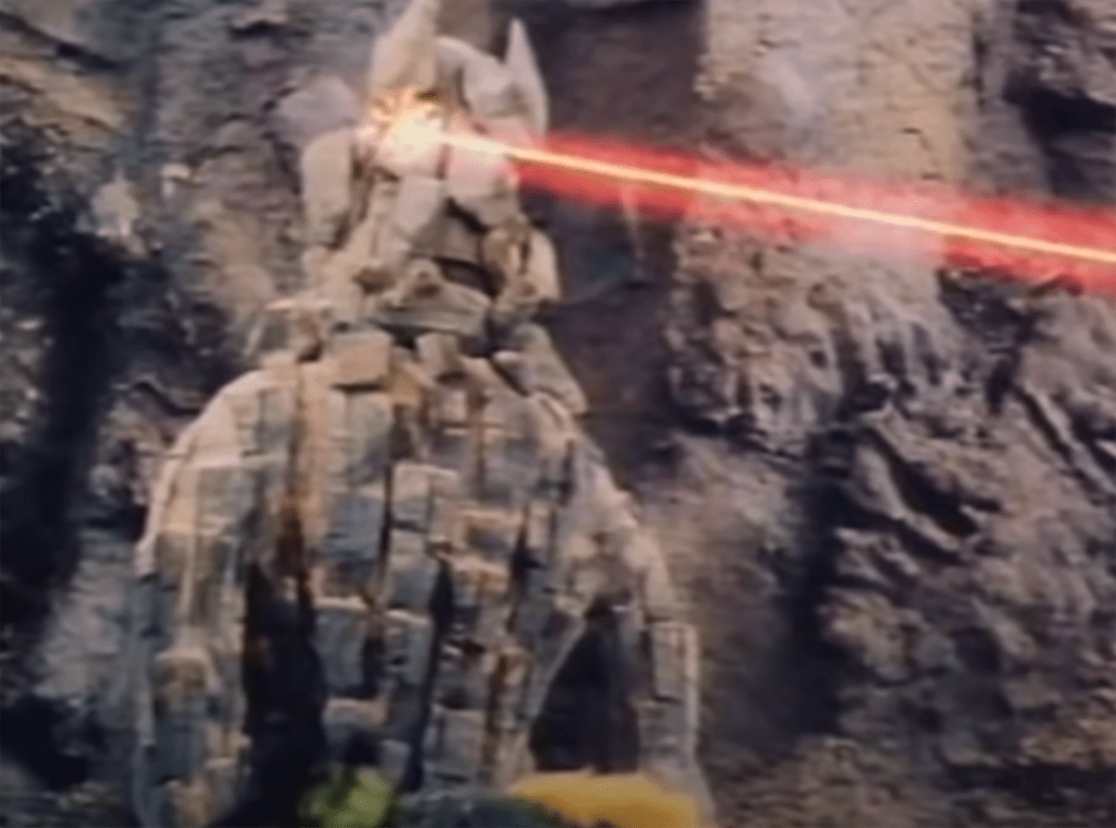 Ty fires a heat ray that blows up the boulder man's head...