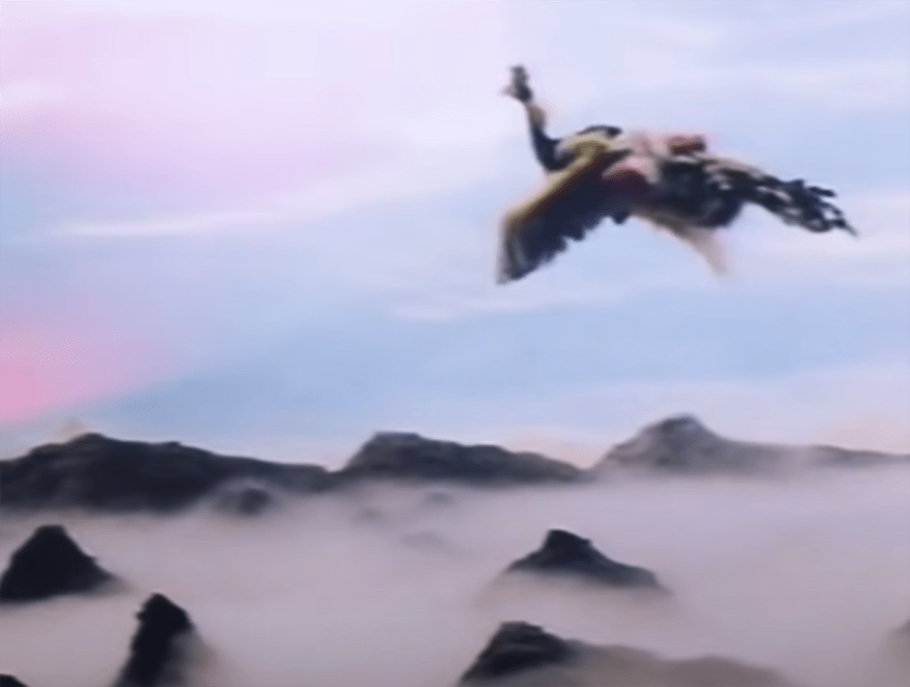 The stiff-winged puppet, er, I mean the giant majestic phoenix, flies over the island