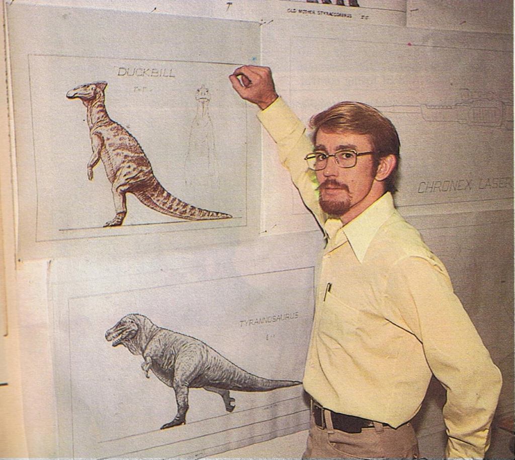 Jim Danforth stands next to some of his preproduction drawings