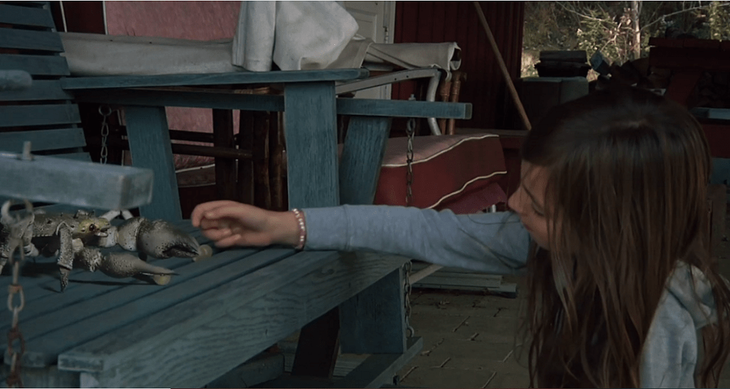 Our young heroine feeds the crab special grapes