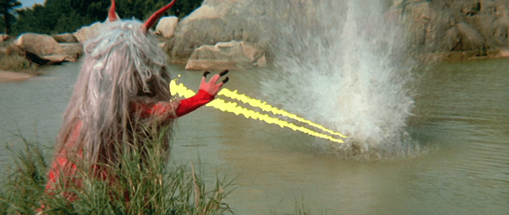 Cackling villain with long hair fires lasers from its hands