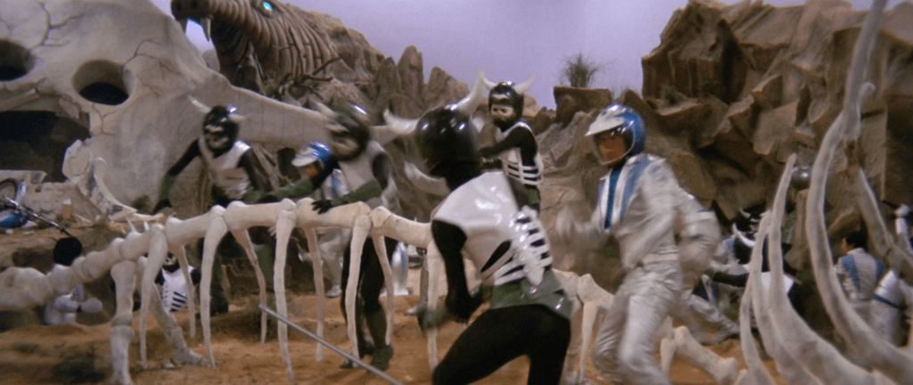 Goodies and baddies fight it out in a sound stage set full of giant ribcages and skulls