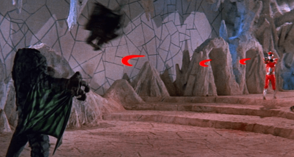 Inframan fires his red laser blade beams and cuts off Dragon-Elzebub's head!