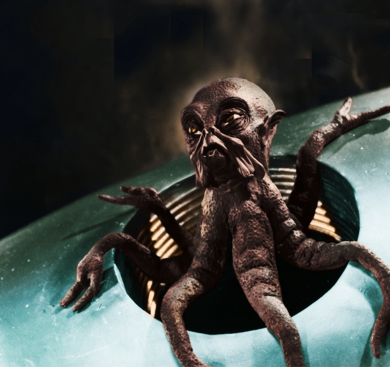 A tentacled Martian crawls into view