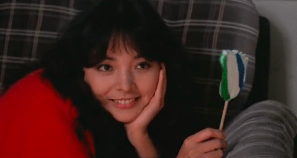 Pok Pok licks a lollipop...