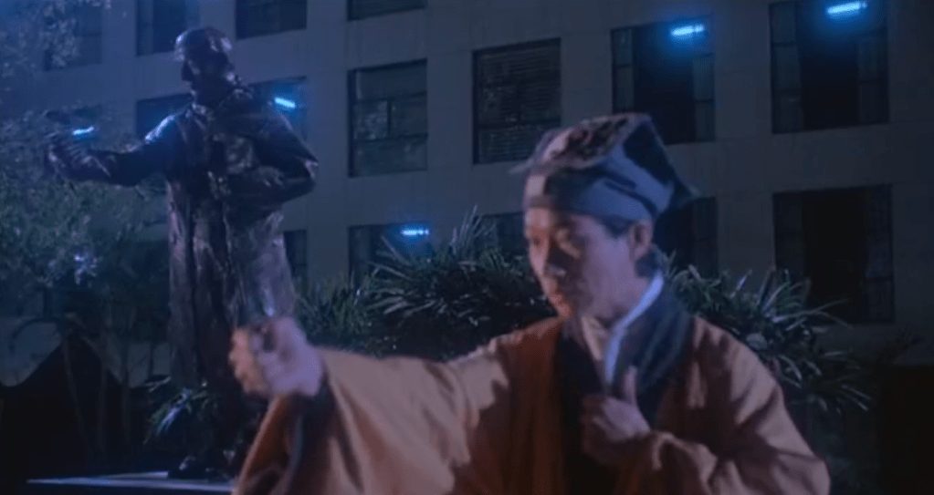 The statue mimics the priest's movements!