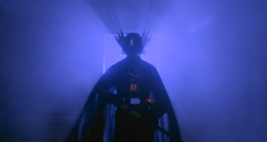 After making a bunch of demolition workers turn naked by hitting them with his (plastic-looking) lightsabre, the Black Night disappears