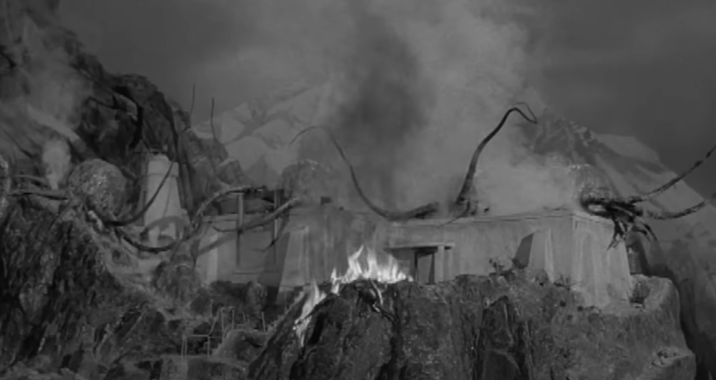 The evil extraterrestrials climb onto the roof of the observatory