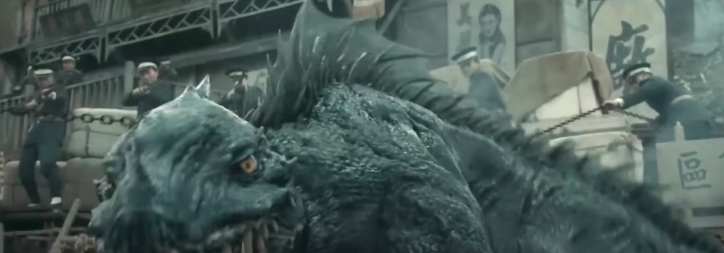 The cops snag the creature with grappling hooks and shoot at it, but to no avail...