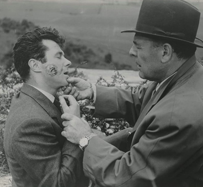 Marsh (Bryan Forbes) succumbs to a micro alien that enters his body via a V-shaped scar