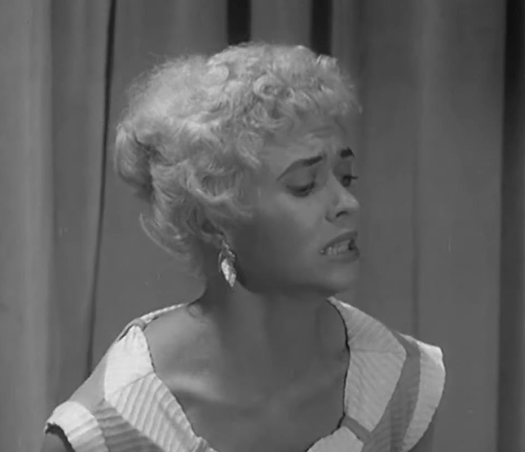 
Sheila (Vera Day) becomes a victim of an alien  projectile