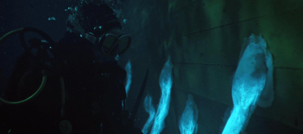 The bioluminescent tentacle-appendages attach themselves to the ship's hull with suckers... 