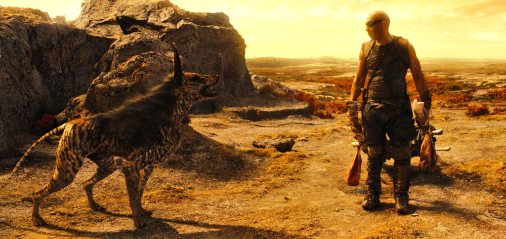 Riddick and an alien hyena-dog