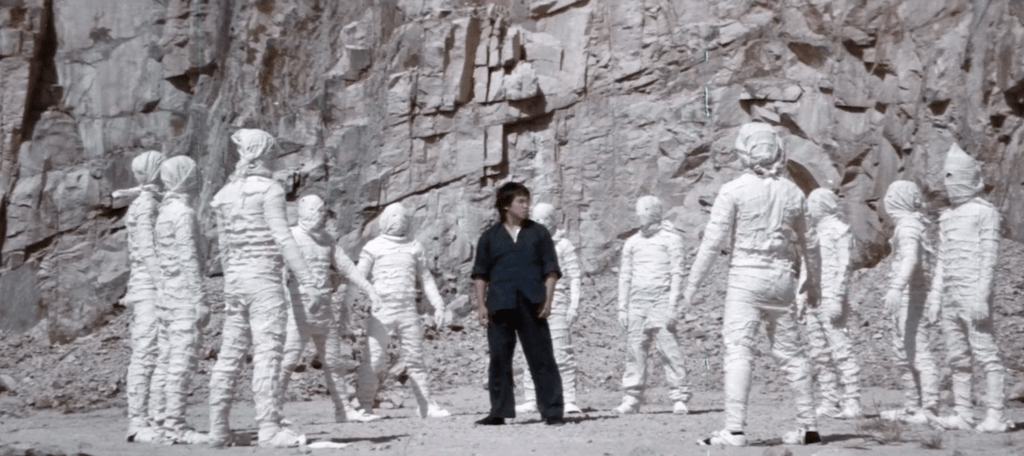 Bruce is surrounded by kung fu-skilled mummies!