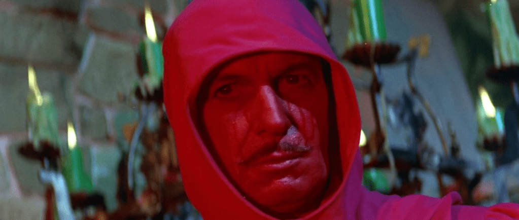 The Red Death reveals his face... and it is the face of Vincent Price!