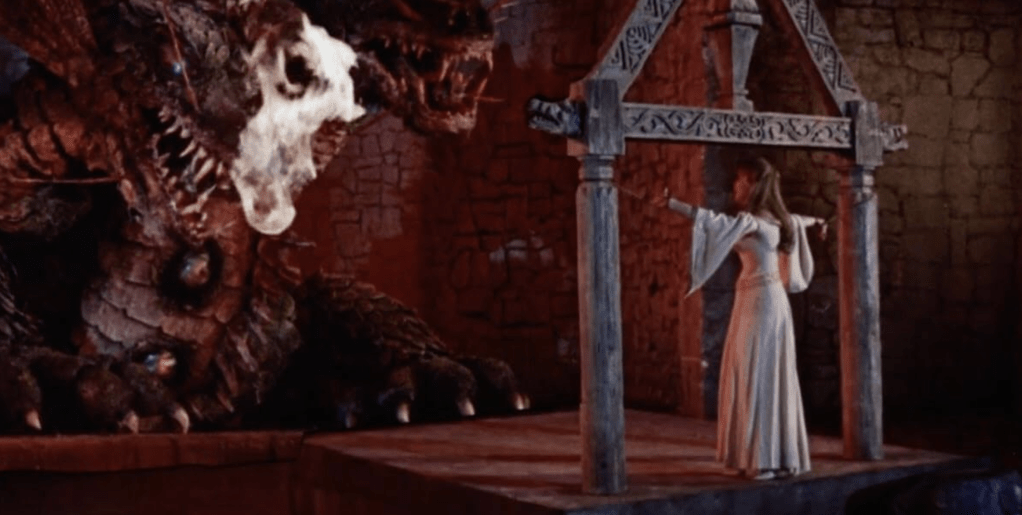 Helene is tied-up, ready to be the dragon's latest victim