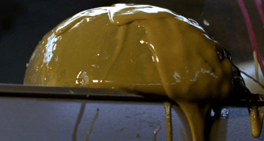 Above: two shots of the green, slimy alien eggs