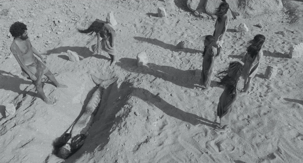 The stranded Sea Maiden is buried by Hayat and her father (played by Yagoub Alfarhan)
