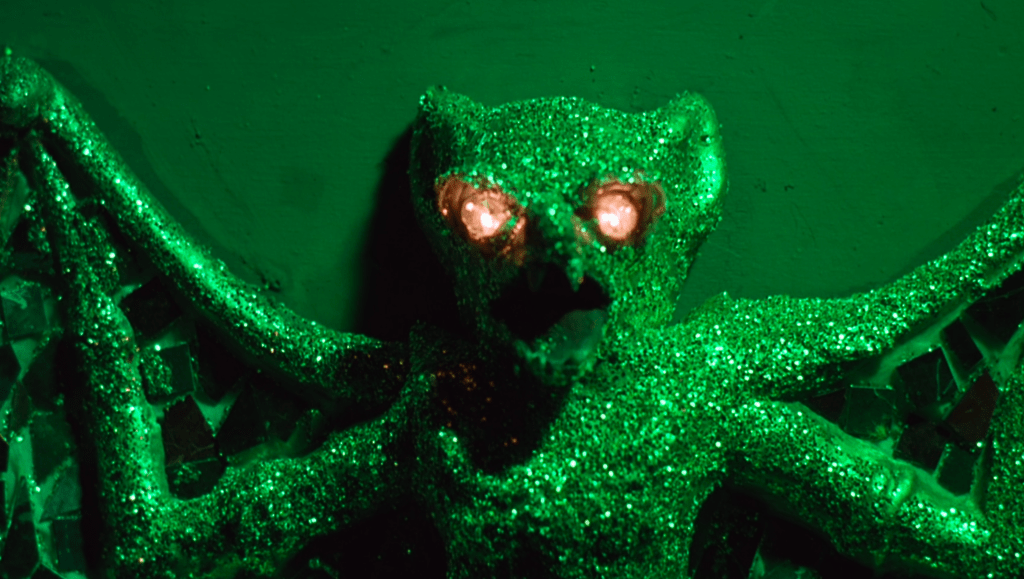 A close-up of the glowing-eyed bat ornament that somehow comes alive