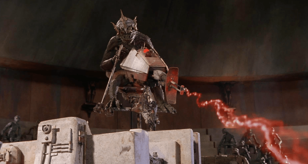 A lizard-dude gunner zaps the yeti to make the creature fight in the arena