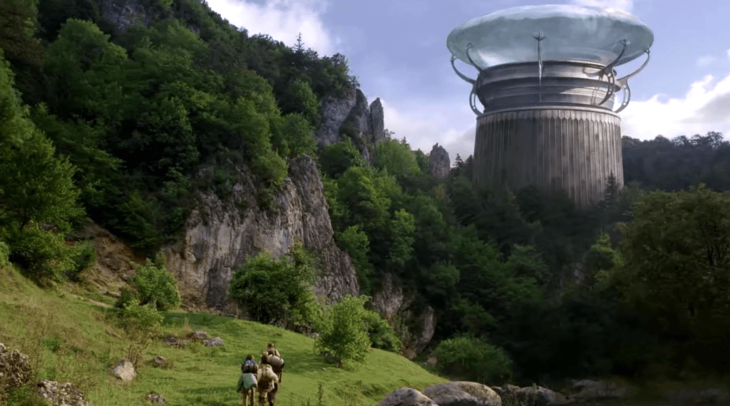 The group approaches one of the alien towers