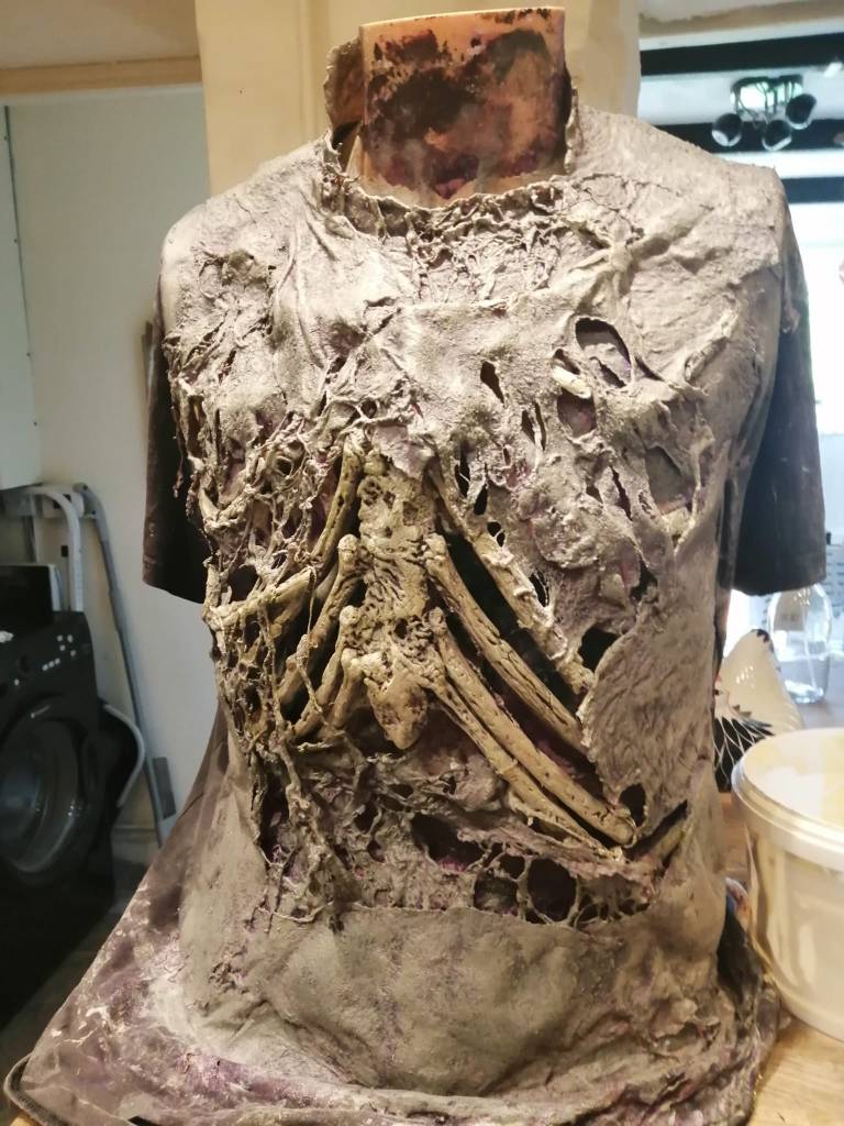 Cotton batting, impregnated with liquid latex, is used to create the zombies' dead skin