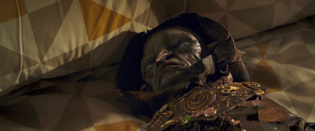 A Redcap gets knocked onto a bed