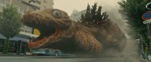 The earlier-stage Godzilla has grotesquely-wobbling gills and freaky, staring eyes!
