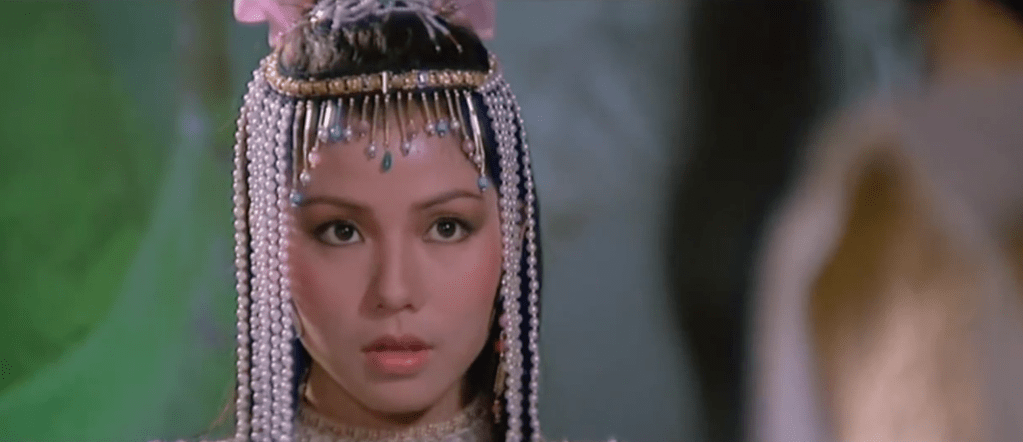 The heroine looks on