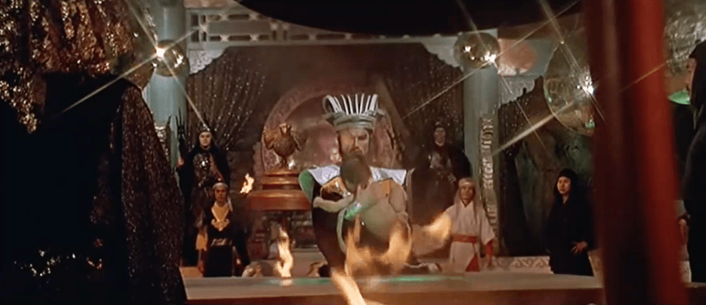 The bad guy leader of the Intelligent Kingdom decides this child is not intelligent enough... so a guard hurls the youngster into a flaming furnace! Yikes!