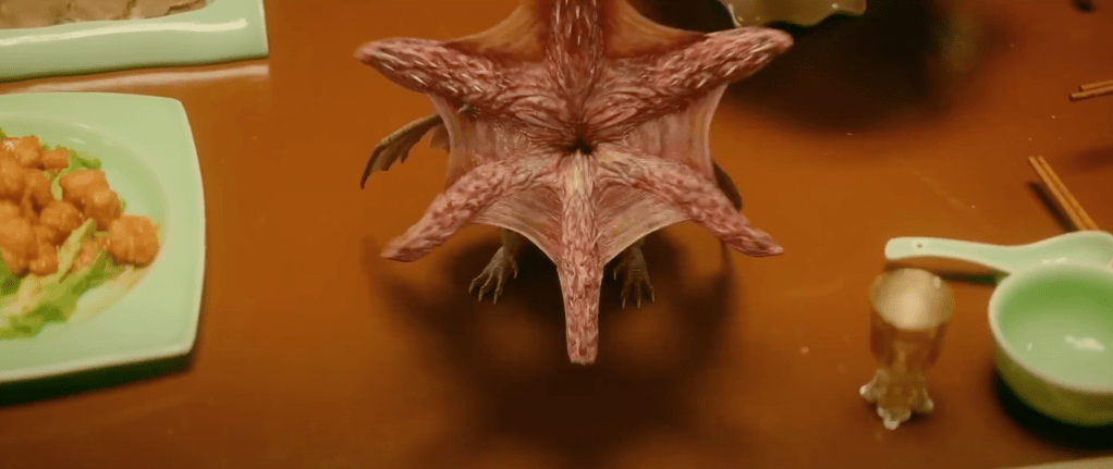 
A winged mini-monster's face peels open in a squid-like manner...