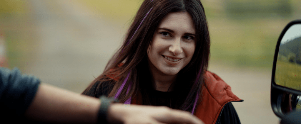 The friends pick up a blogger (Sarah T. Cohen), who joins them on their trip