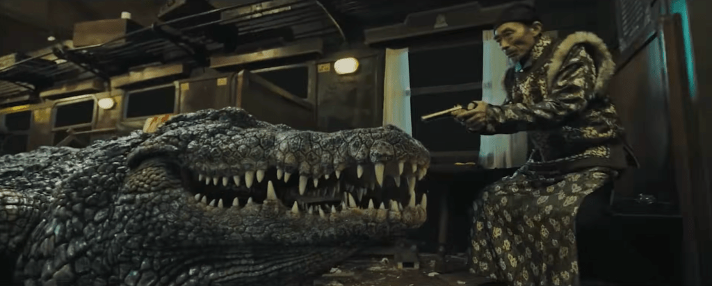 I don't think that little gun is going to stop the croc...