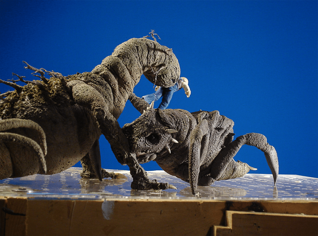 The reptile-bug beast puppet and the animal/plant monster puppet (plus a puppet of Mart) ready to animate in front of a blue screen